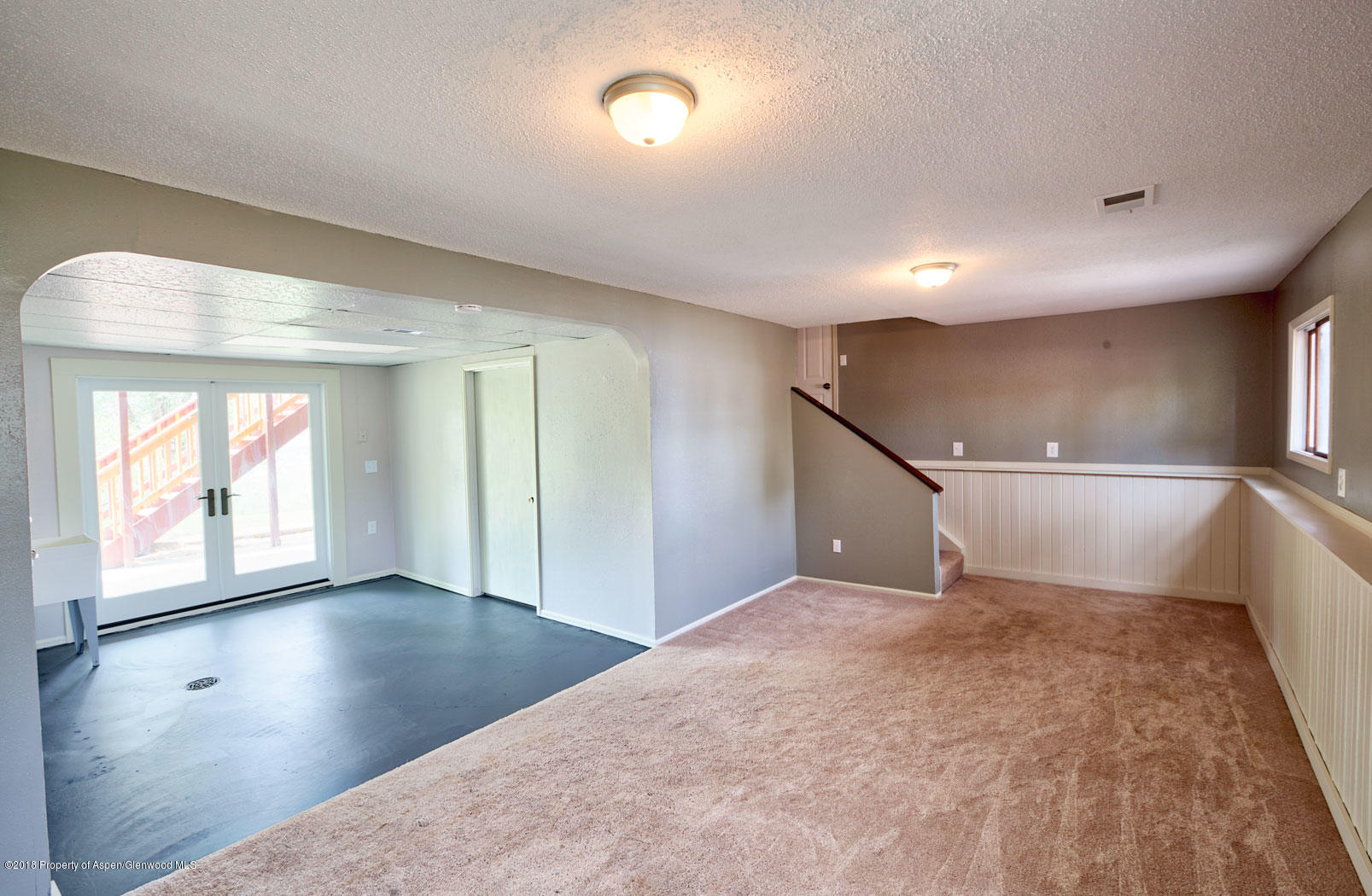1017 Arnold Court Rifle, CO 81650 - Photo 20 of 28 an empty room with wooden floor and windows