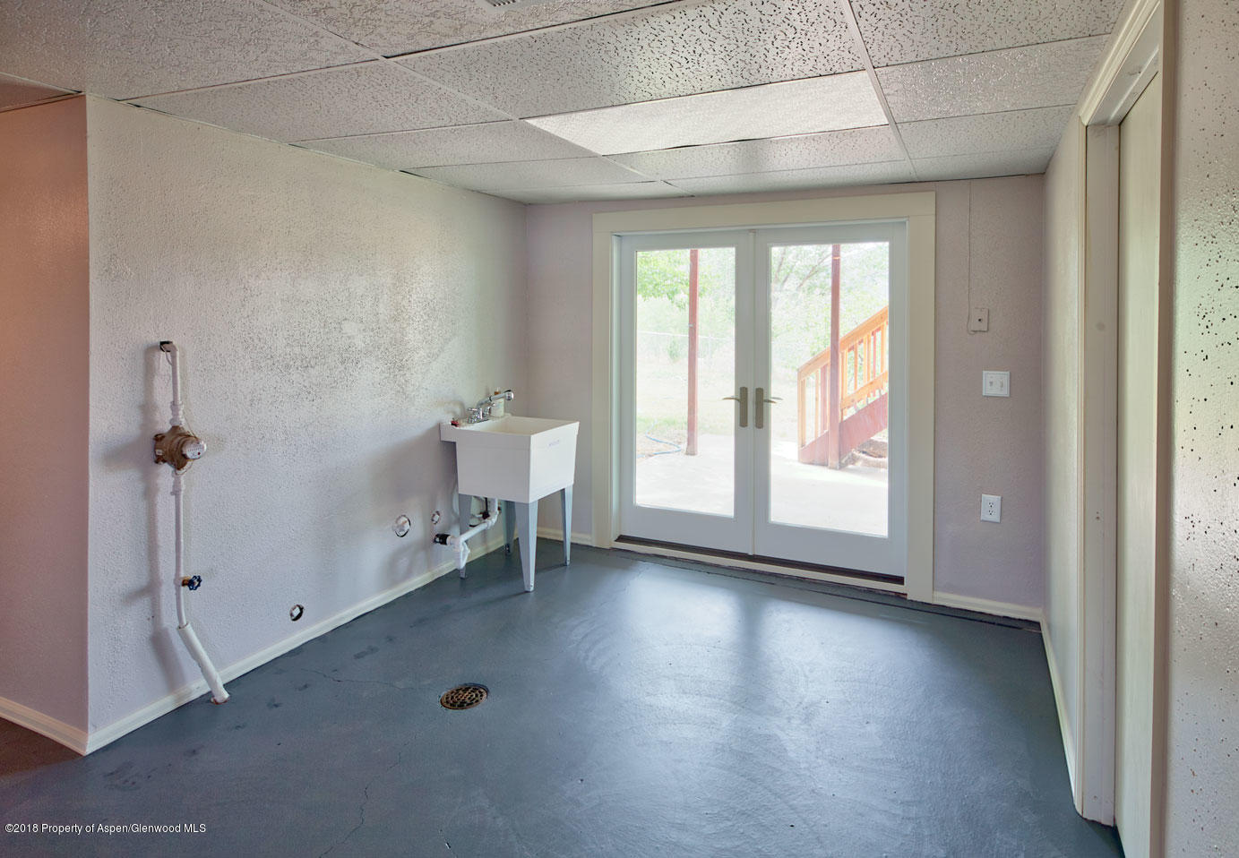 1017 Arnold Court Rifle, CO 81650 - Photo 21 of 28 wooden floor and windows in an empty room