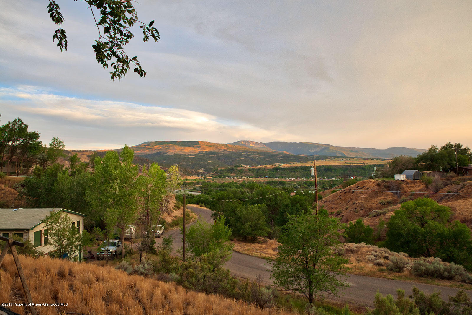 1017 Arnold Court Rifle, CO 81650 - Photo 25 of 28 a view of a city with lush green forest