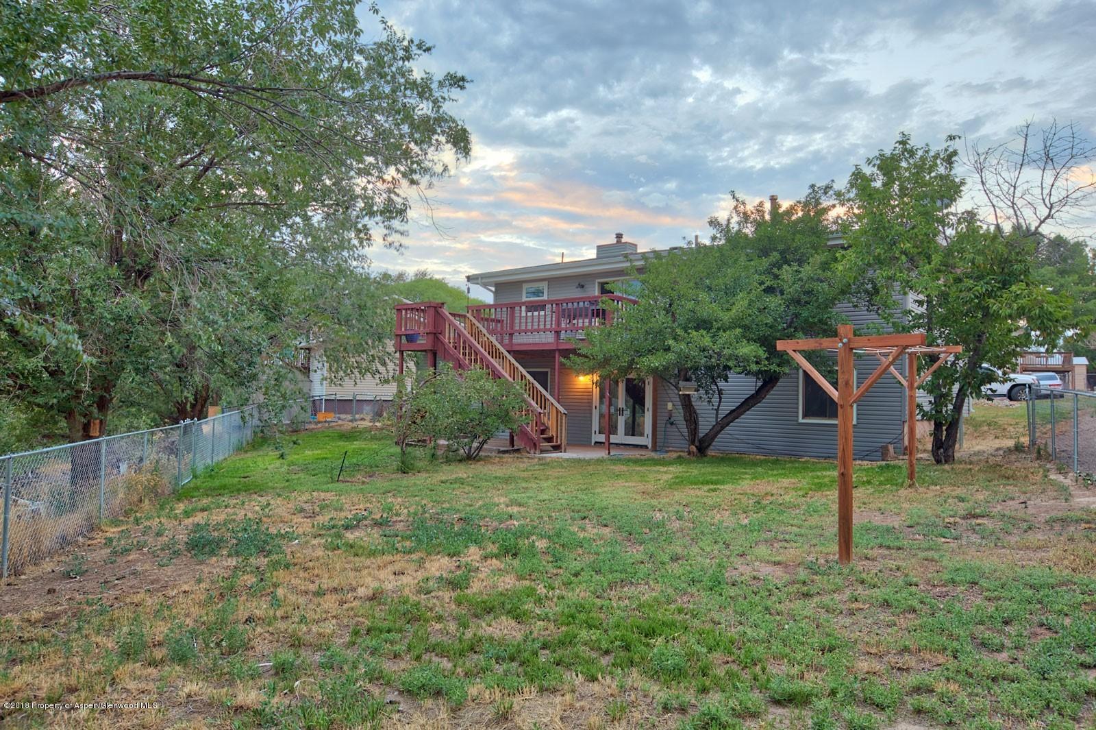 1017 Arnold Court Rifle, CO 81650 - Photo 28 of 28 a view of a house with yard and a tree