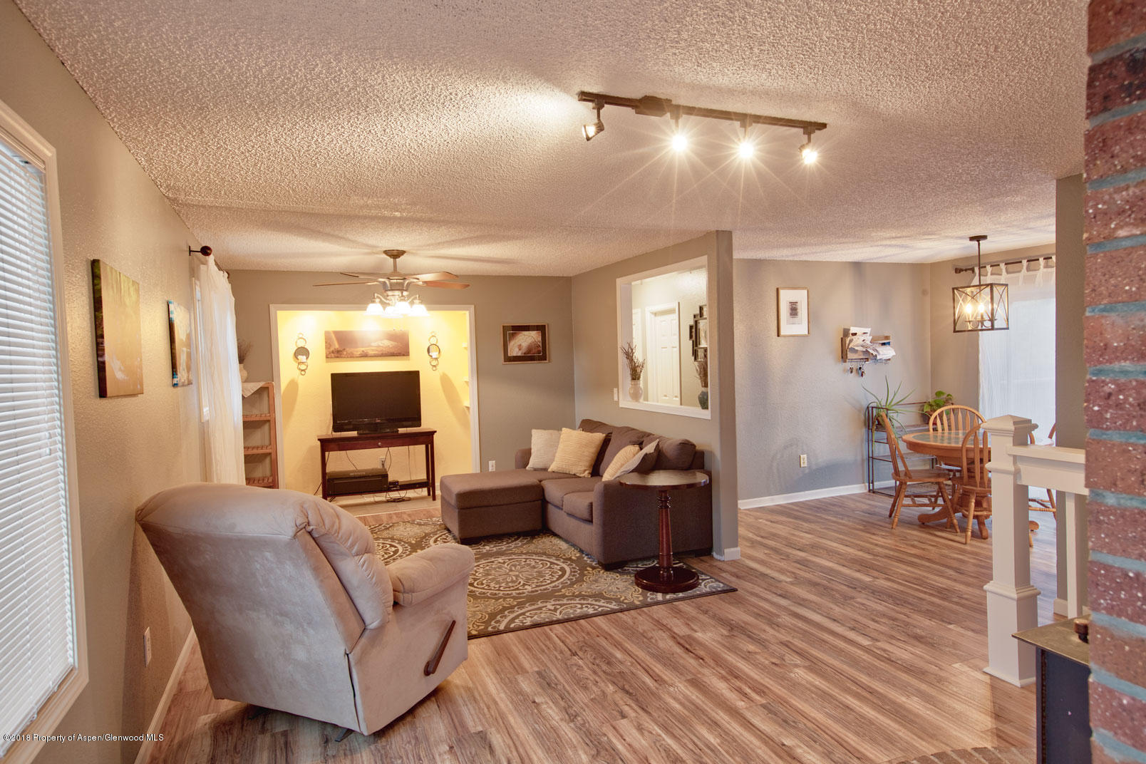 1017 Arnold Court Rifle, CO 81650 - Photo 3 of 28 a living room with furniture and a wooden floor