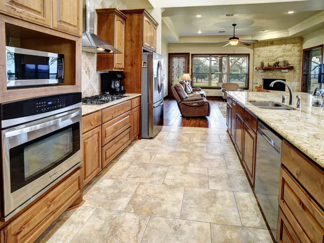 a spacious bathroom with a granite countertop tub and a sink