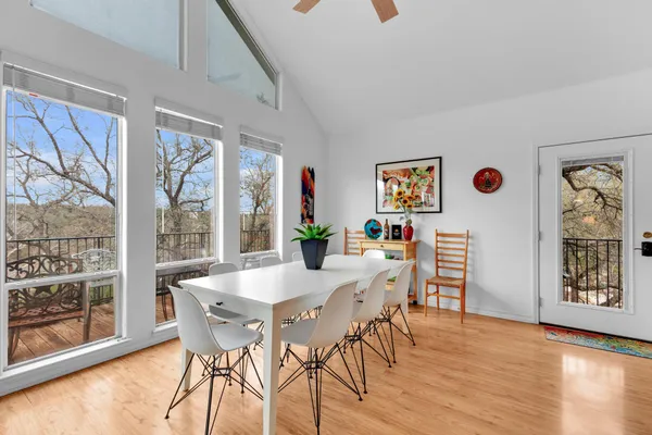 a view of a dining room with furniture window and wooden floor