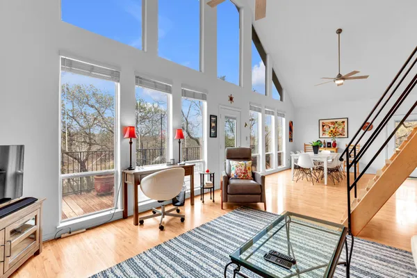 a living room with furniture and wooden floor