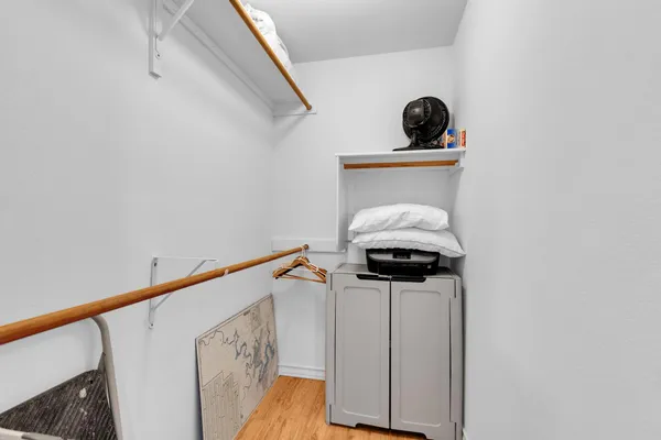 a bedroom with two beds and a dresser