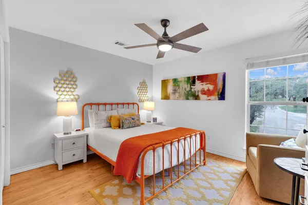 a bathroom with a toilet a sink and a mirror