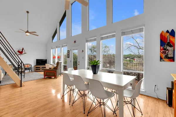 a kitchen with stainless steel appliances granite countertop a stove and a wooden floors