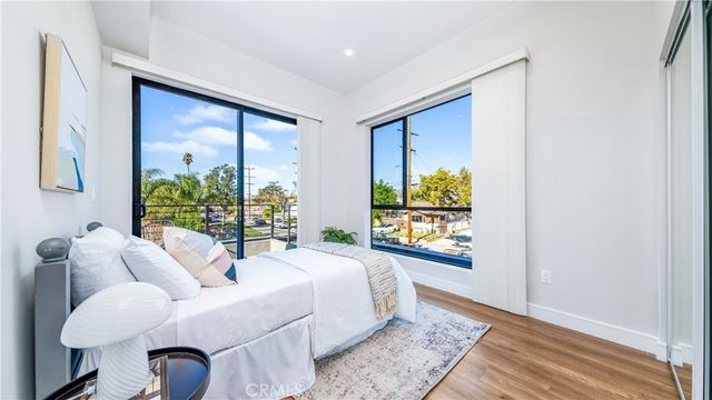 a bedroom with furniture and a window