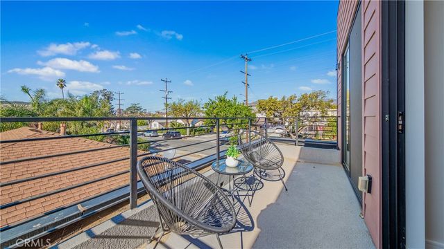 a view of a balcony with chairs