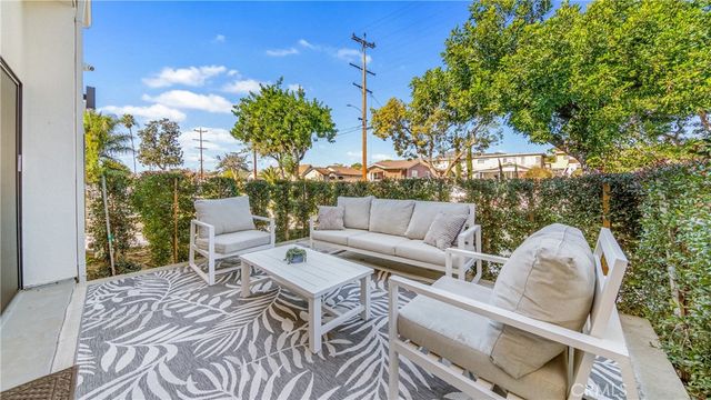 a view of a patio in the backyard