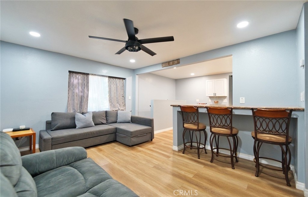 29083 Hook Creek Road Cedar Glen, CA 92321 - Photo 11 of 50 a living room with furniture and a wooden floor