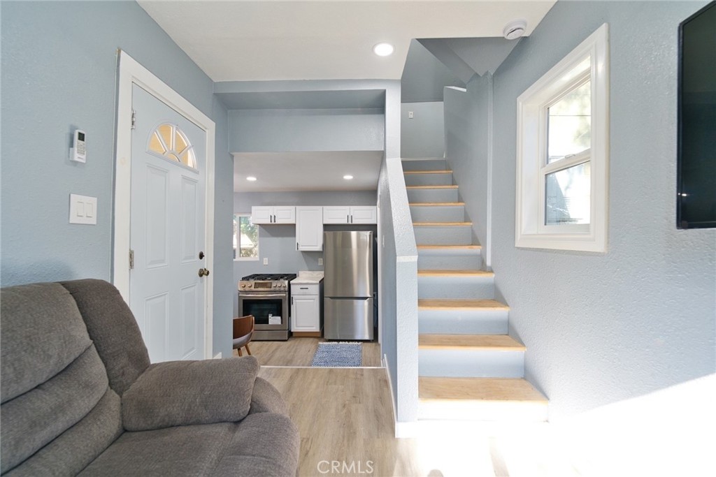 29083 Hook Creek Road Cedar Glen, CA 92321 - Photo 26 of 50 a living room with furniture and a fireplace