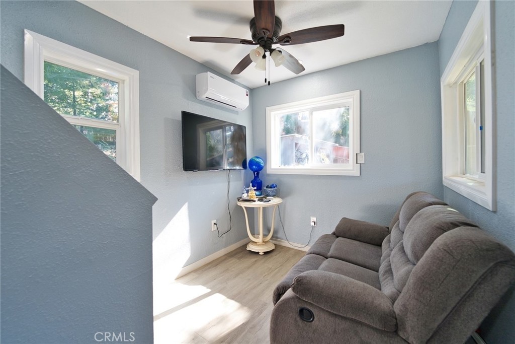 29083 Hook Creek Road Cedar Glen, CA 92321 - Photo 27 of 50 a living room with furniture and a flat screen tv