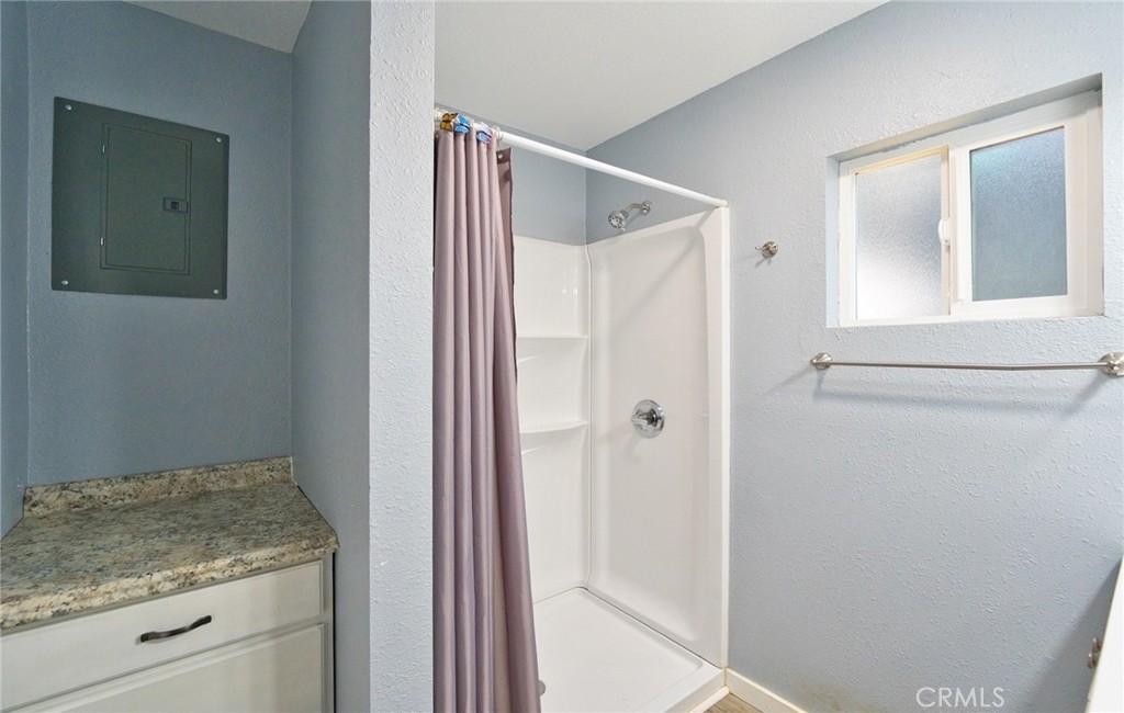 29083 Hook Creek Road Cedar Glen, CA 92321 - Photo 32 of 50 a bathroom with a granite countertop sink and shower