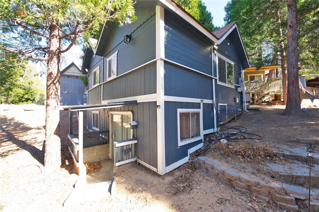 29083 Hook Creek Road Cedar Glen, CA 92321 - Photo 6 of 50 a view of a house with a yard covered in snow