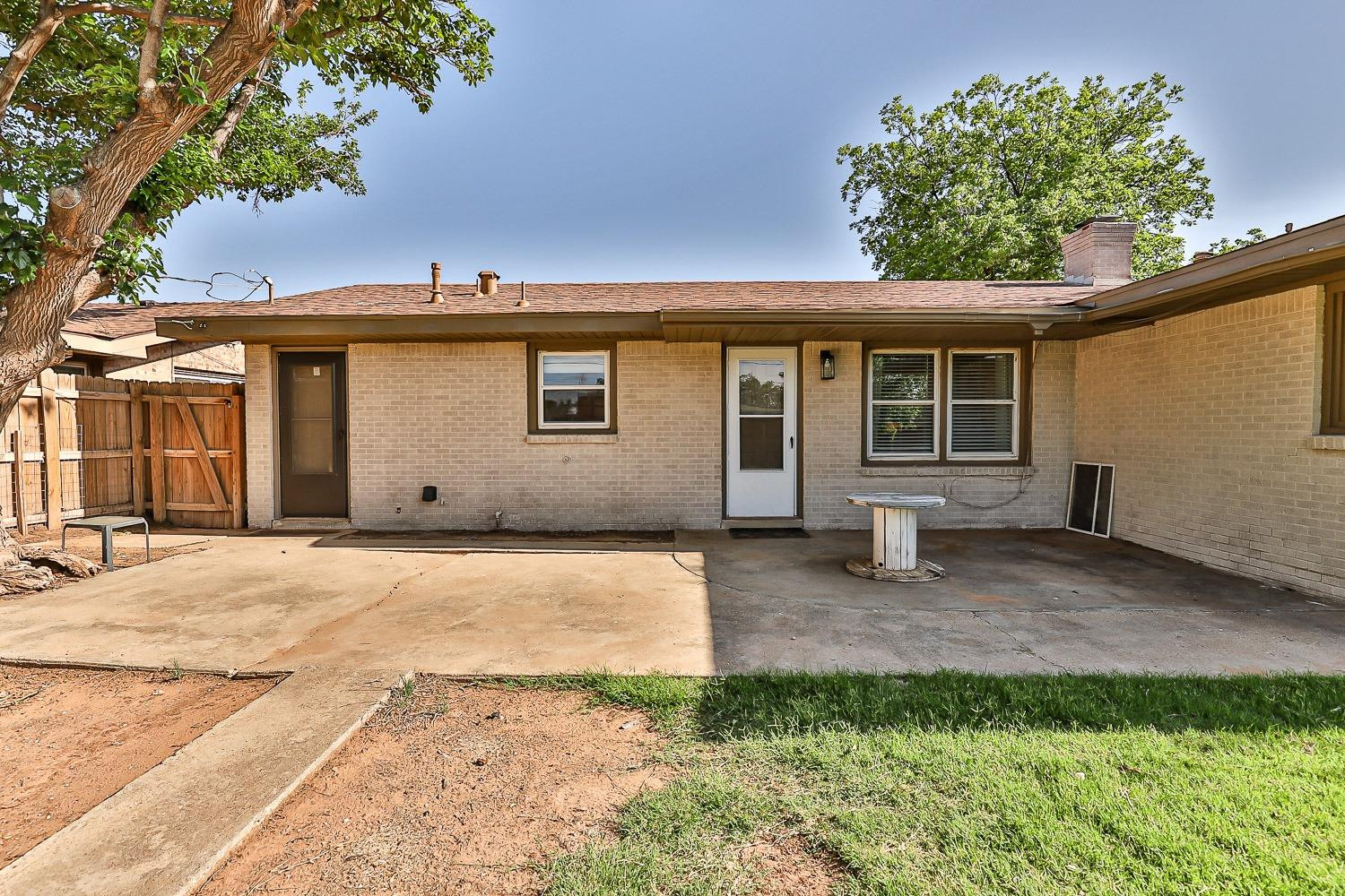 5221 14th Street Lubbock, TX 79416 - Photo 30 of 34 a backyard of a house with lots of green space