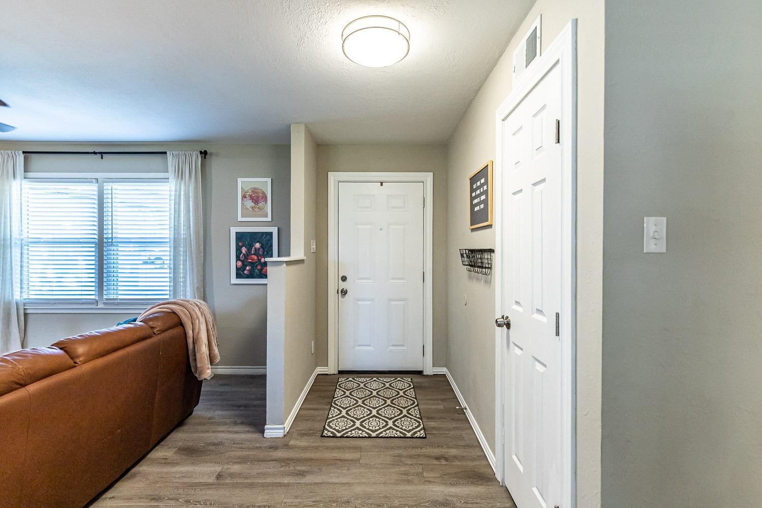 5221 14th Street Lubbock, TX 79416 - Photo 3 of 34 a living room with furniture and a rug