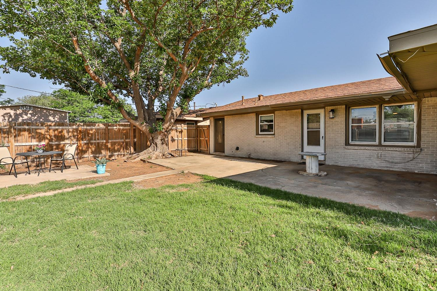 5221 14th Street Lubbock, TX 79416 - Photo 31 of 34 a view of a house with backyard and tree