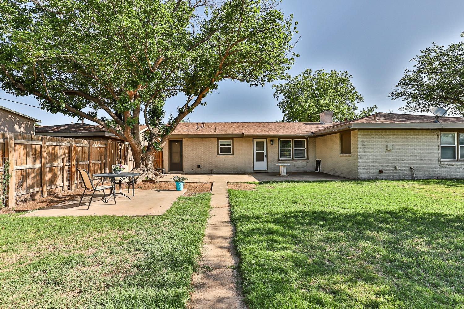 5221 14th Street Lubbock, TX 79416 - Photo 33 of 34 a view of a house with a yard