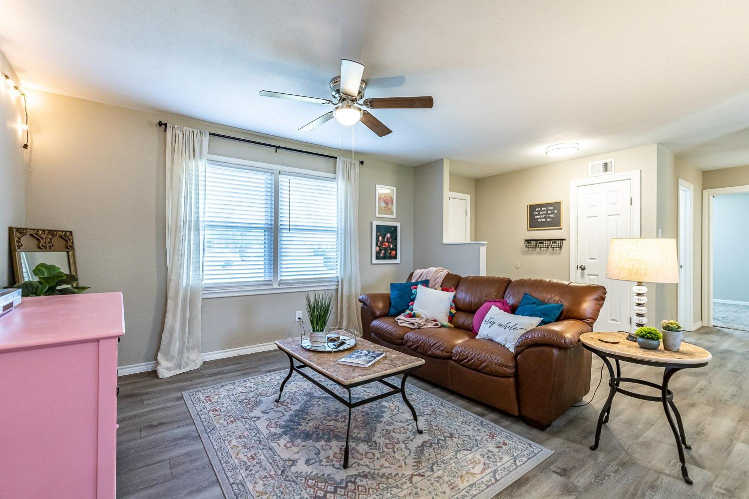 5221 14th Street Lubbock, TX 79416 - Photo 6 of 34 a living room with furniture and a window