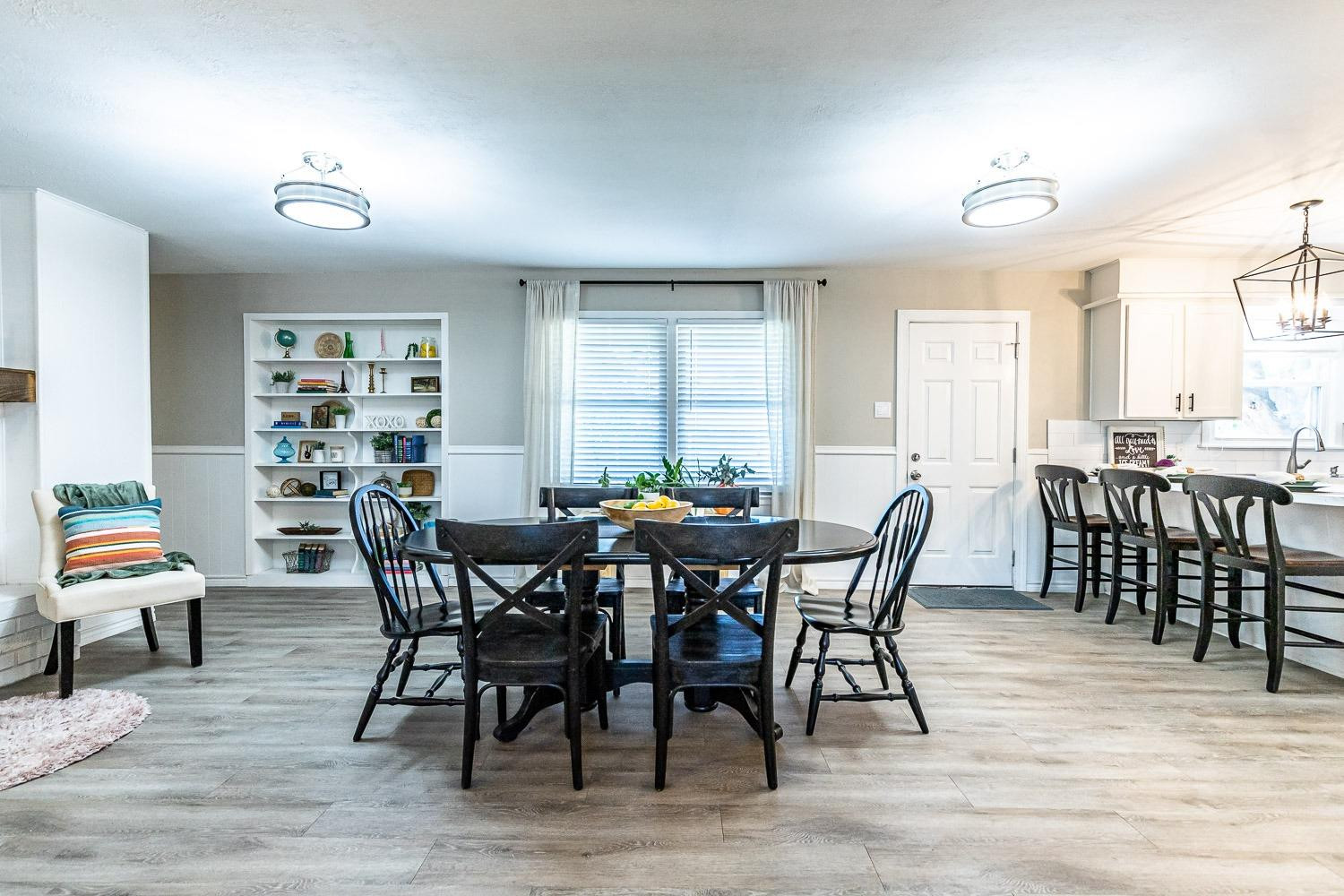 5221 14th Street Lubbock, TX 79416 - Photo 9 of 34 a view of a dining room with furniture and wooden floor