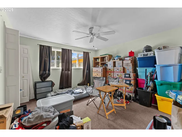 a living room filled with furniture and a flat screen tv