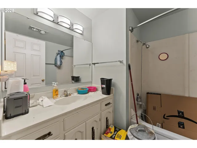 a bathroom with a sink and mirror