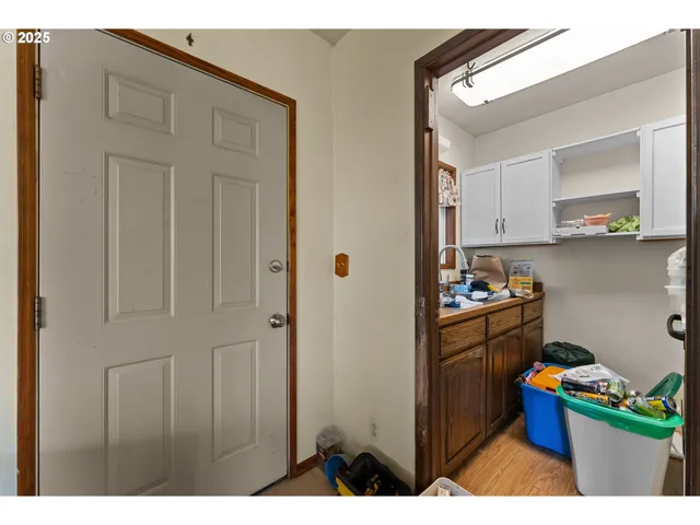 a kitchen with stainless steel appliances kitchen island granite countertop a refrigerator and a stove