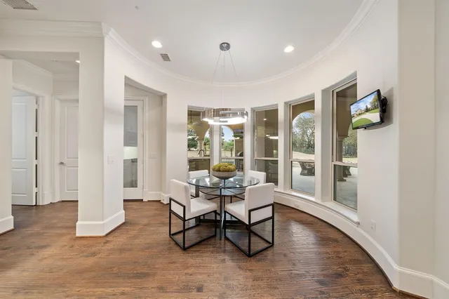 a work room with furniture and wooden floor