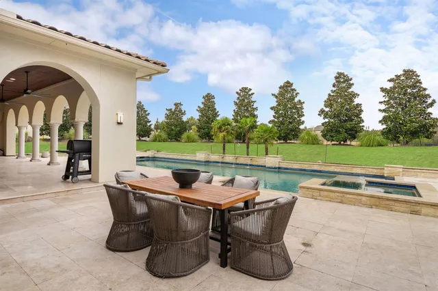 a view of outdoor space with garden and seating area