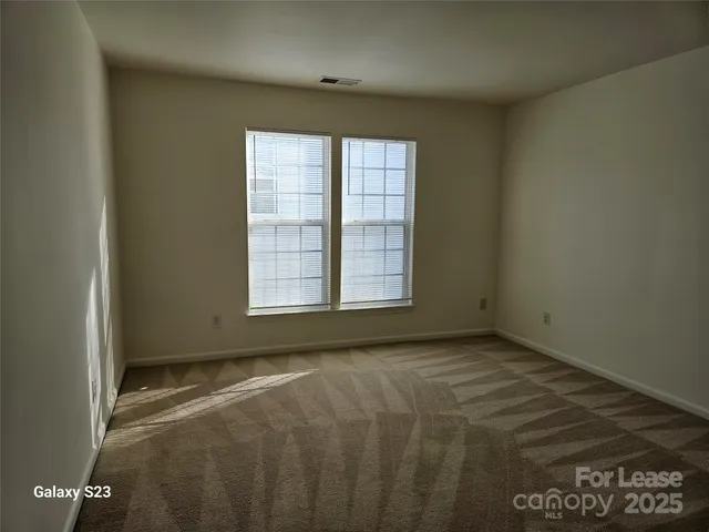 a bathroom with a tub a sink and a large mirror