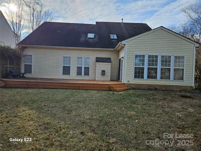 a view of a yard with large trees