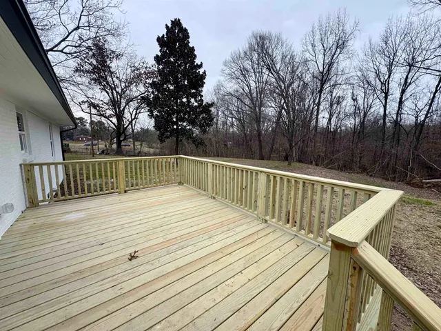 a view of deck with wooden floor and outdoor seating