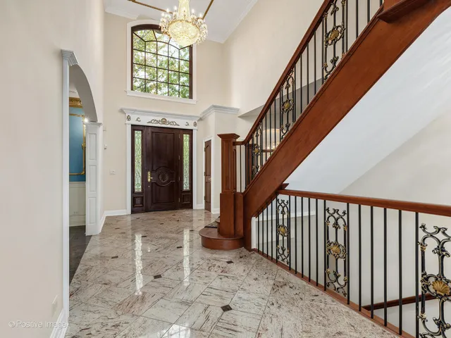 a view of a balcony with a window and front door
