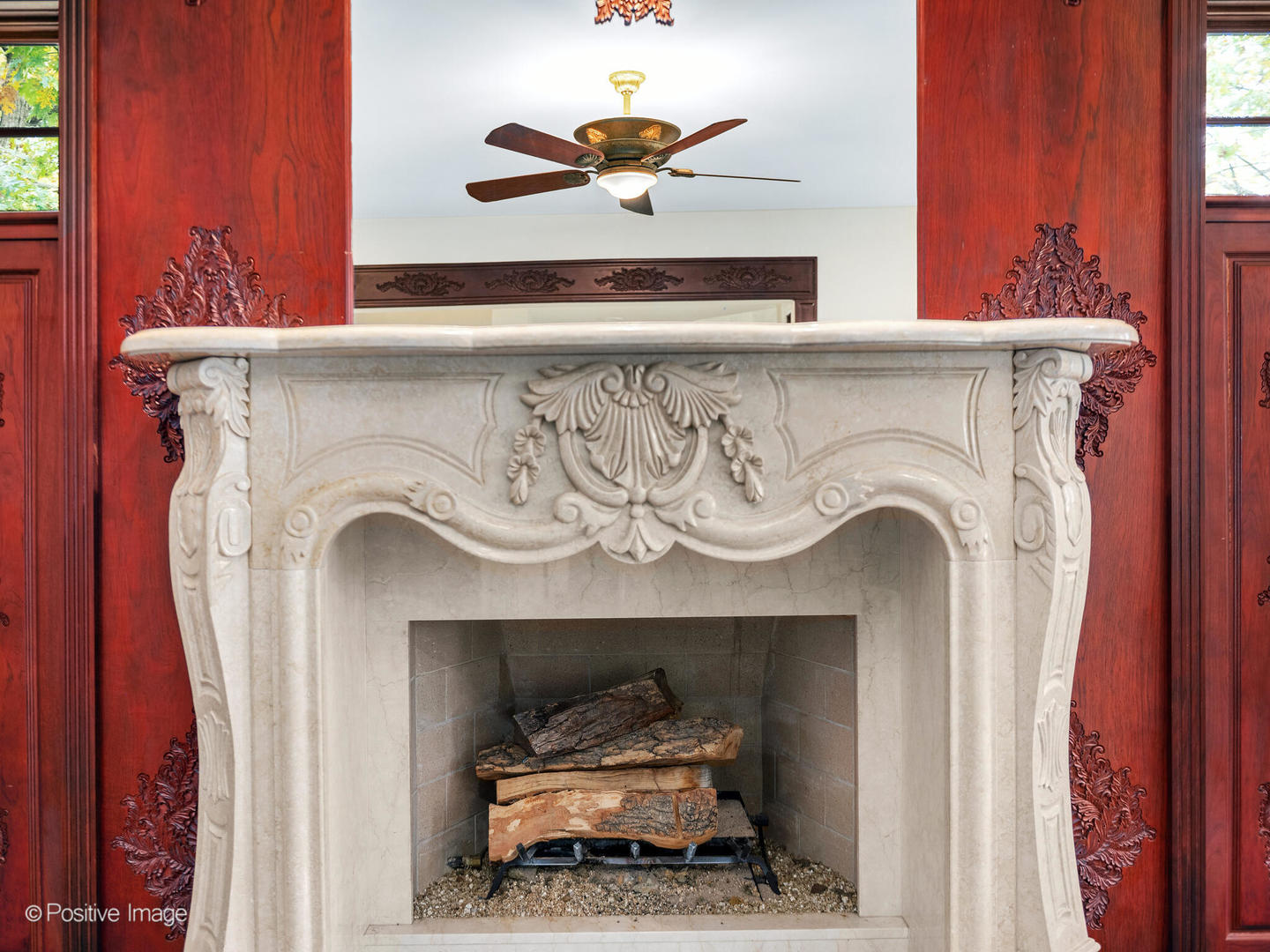 817 Lakeview Lane Burr Ridge, IL 60527 - Photo 29 of 69 a living room with a fireplace