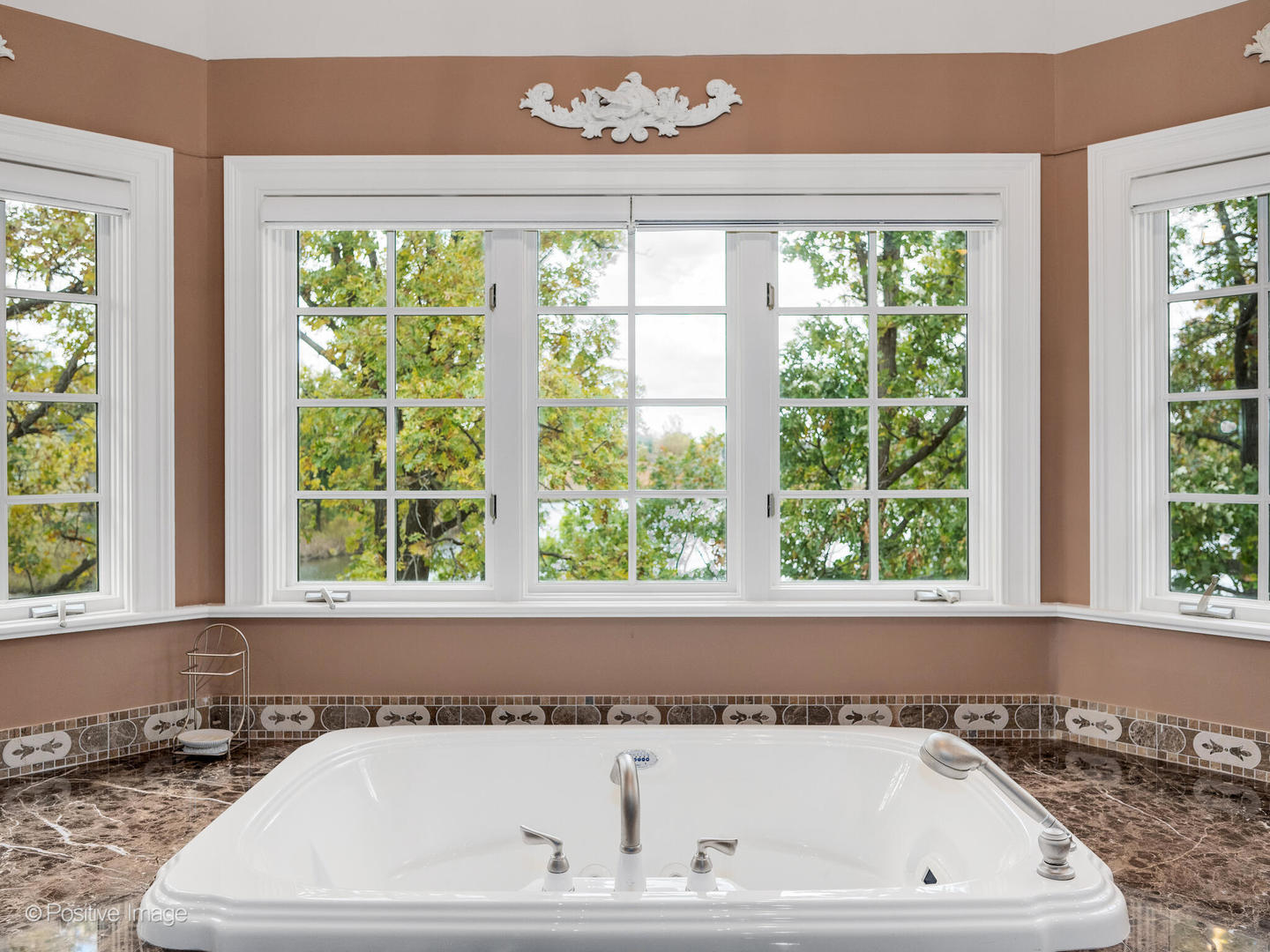 817 Lakeview Lane Burr Ridge, IL 60527 - Photo 45 of 69 a white bath tub sitting in a bathroom next to a window