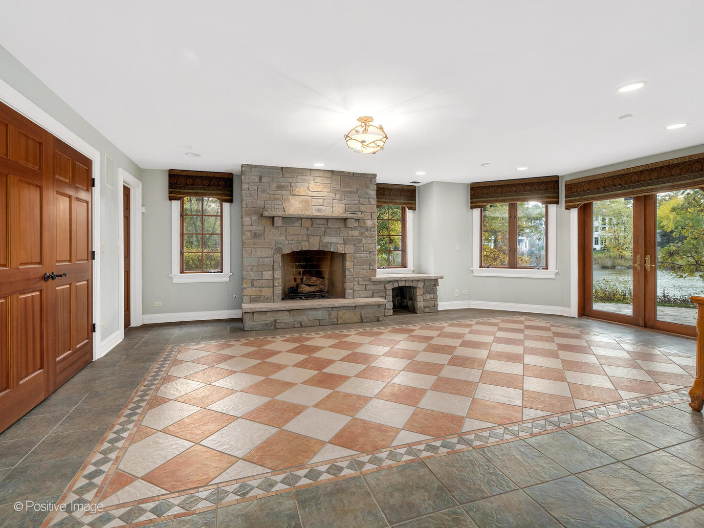 817 Lakeview Lane Burr Ridge, IL 60527 - Photo 56 of 69 a view of an empty room with window and fire place