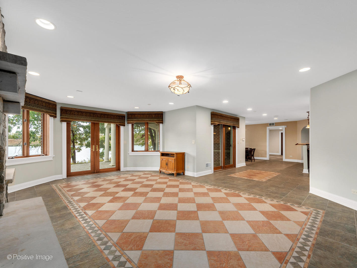 817 Lakeview Lane Burr Ridge, IL 60527 - Photo 57 of 69 a view of a big room with a fireplace and large windows