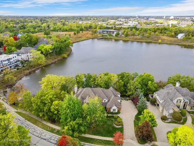 aerial view of a house with a lake view
