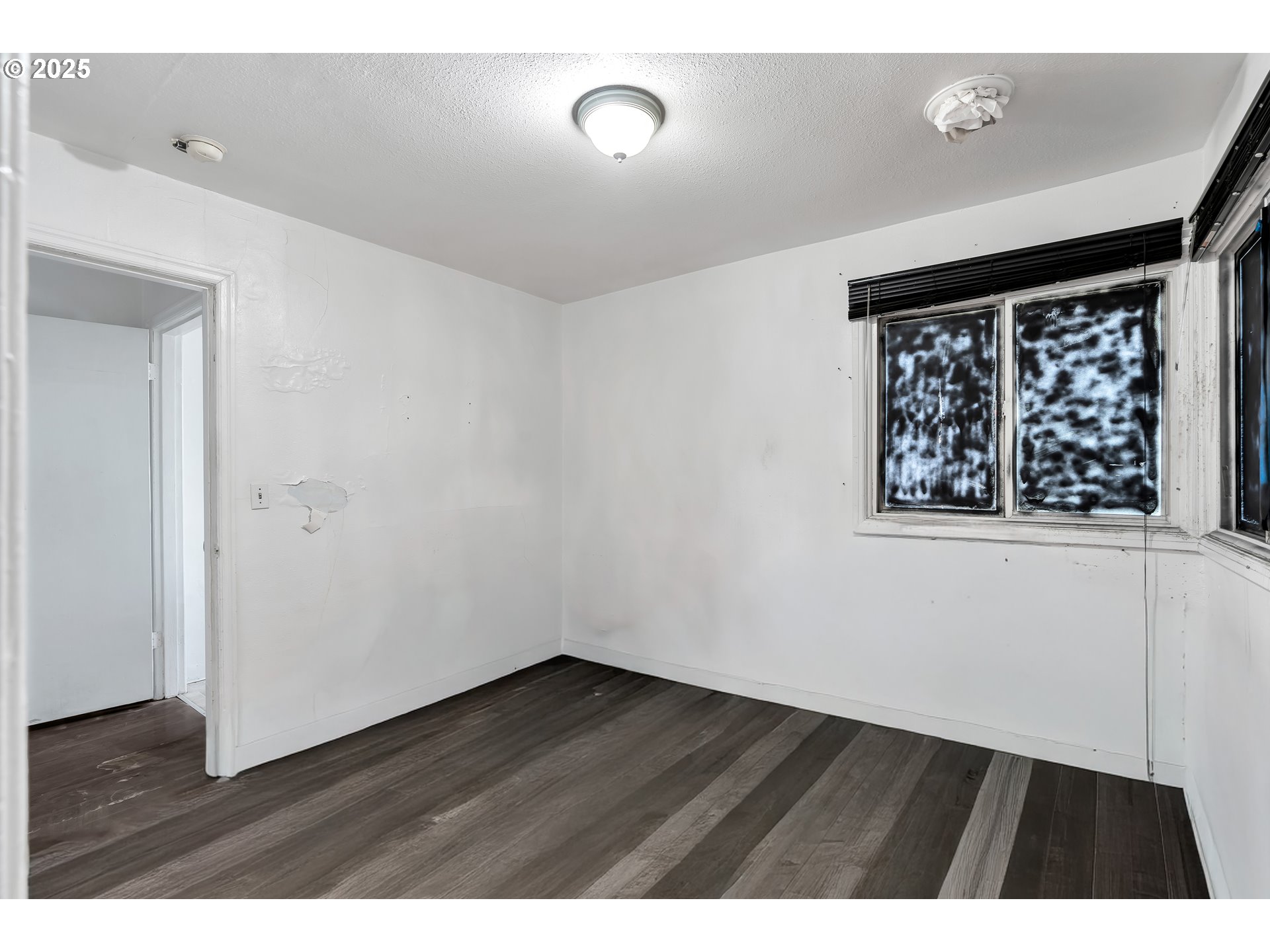 8451 Southeast Bush Street Portland, OR 97266 - Photo 13 of 47 wooden floor in an empty room