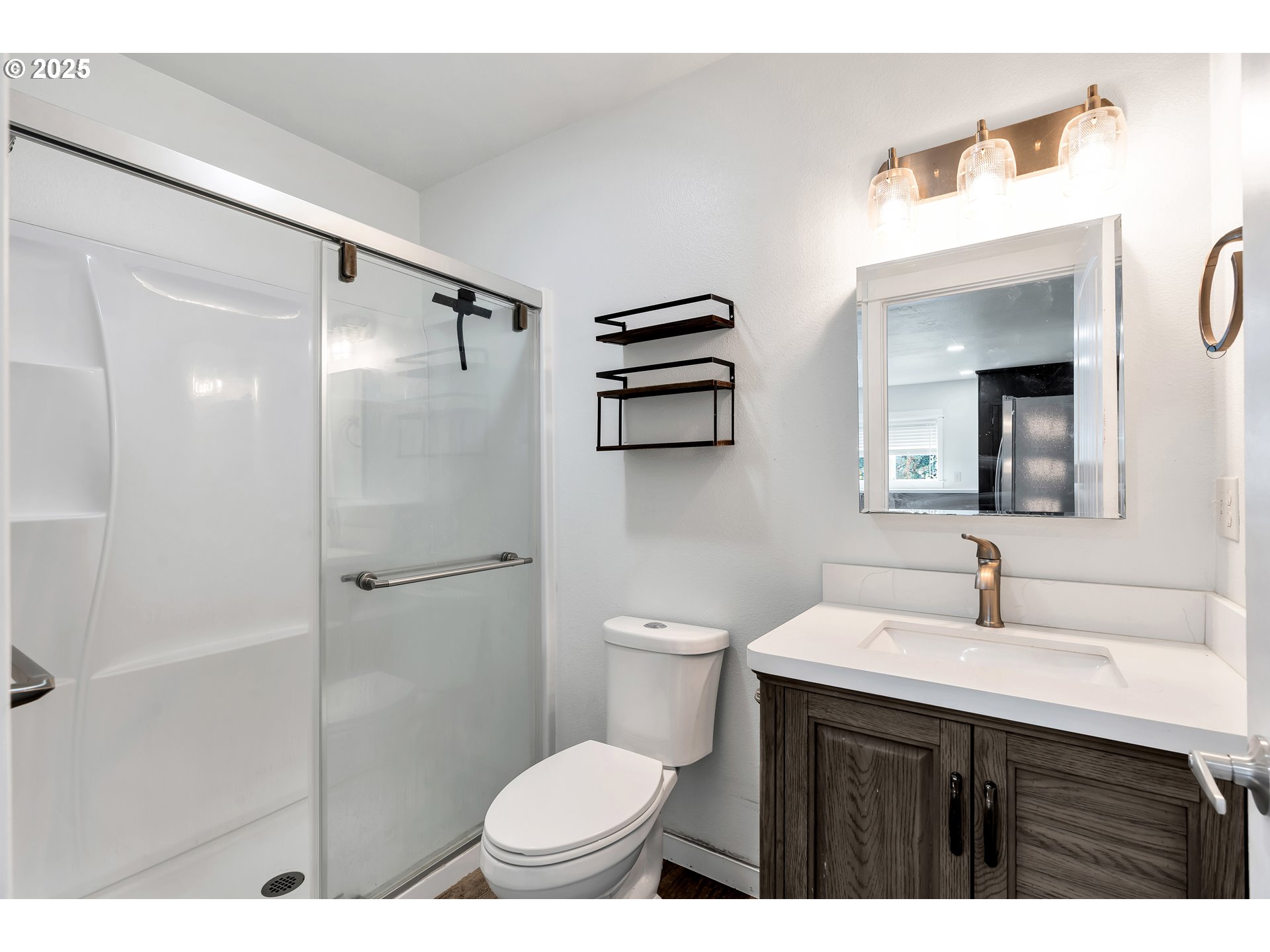 8451 Southeast Bush Street Portland, OR 97266 - Photo 19 of 47 a bathroom with a sink toilet and shower