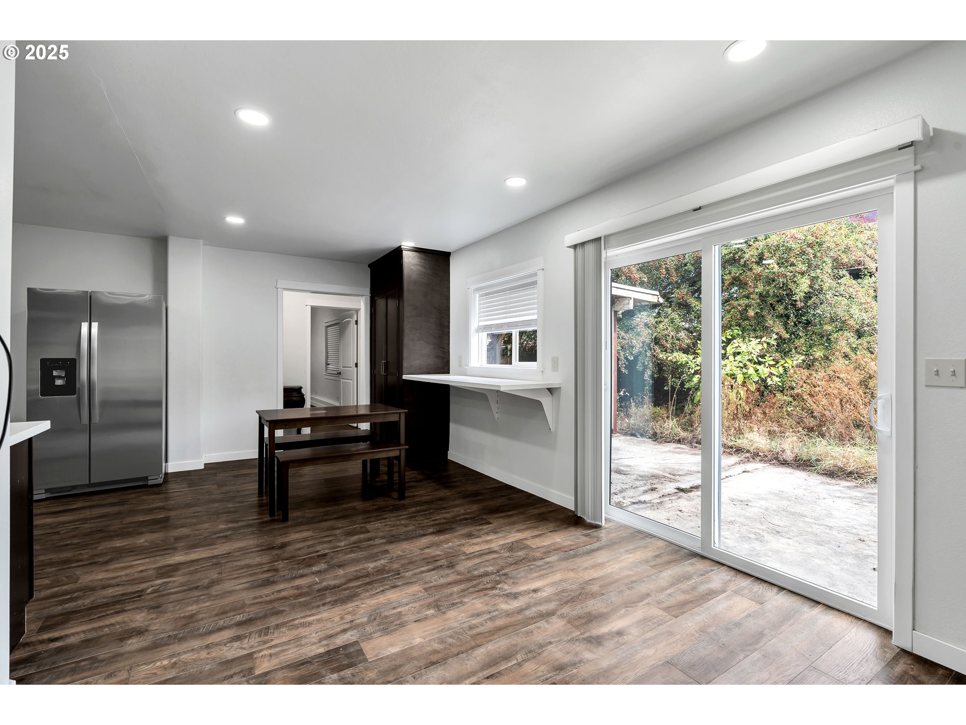 8451 Southeast Bush Street Portland, OR 97266 - Photo 20 of 47 a view of a living room and dining room