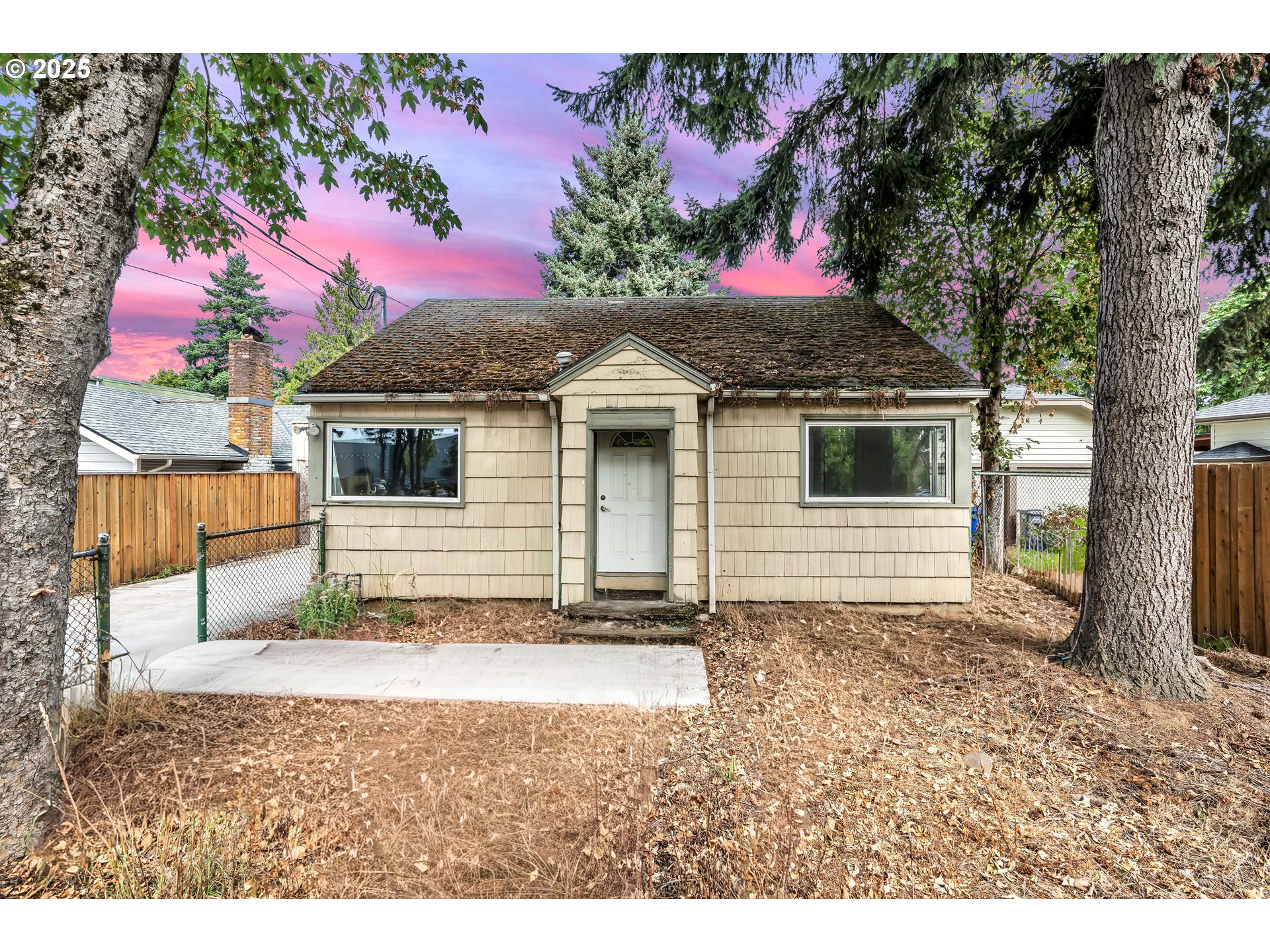 8451 Southeast Bush Street Portland, OR 97266 - Photo 2 of 47 a view of a house with a yard