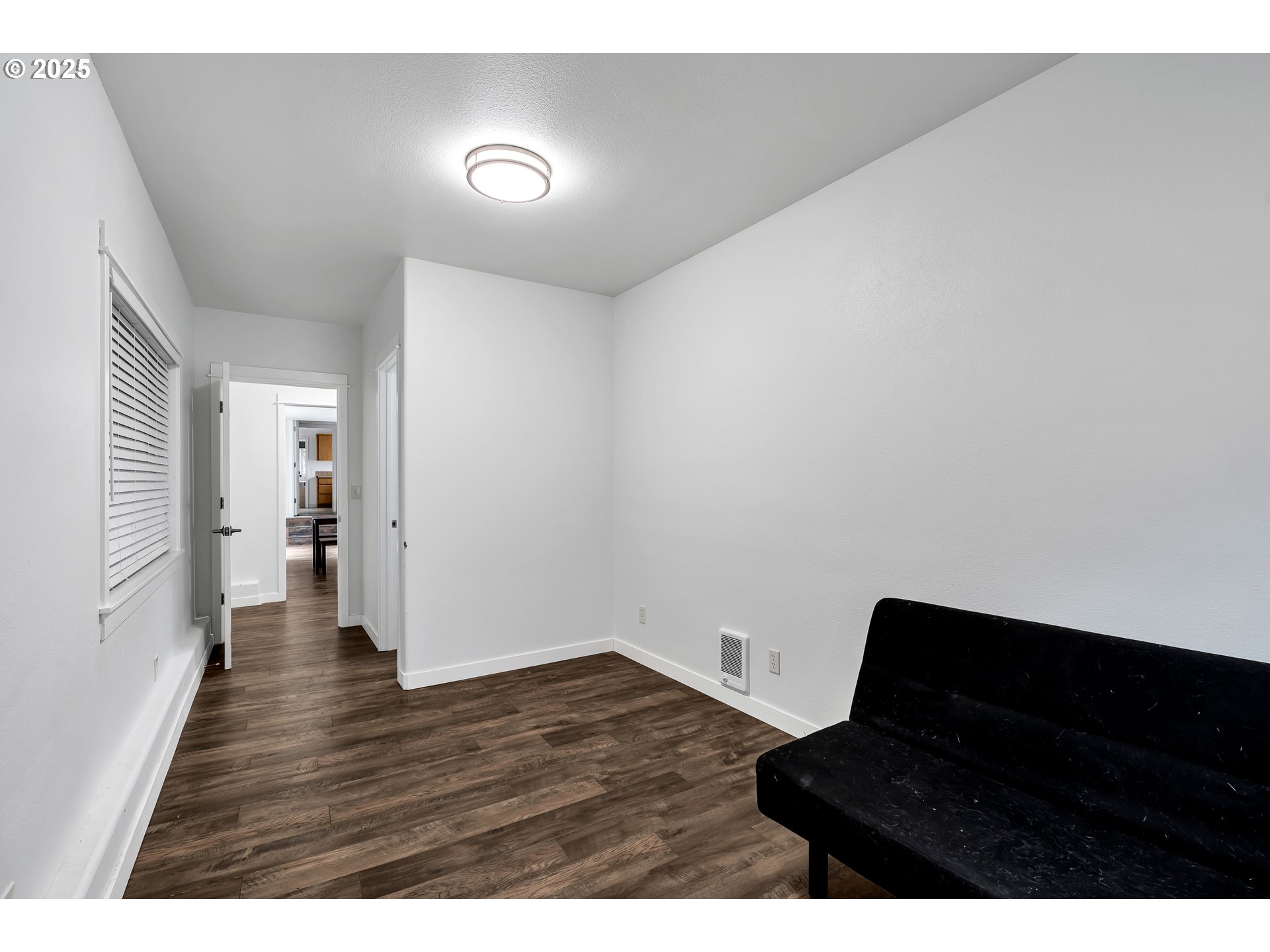 8451 Southeast Bush Street Portland, OR 97266 - Photo 23 of 47 a view of an empty room and wooden floor