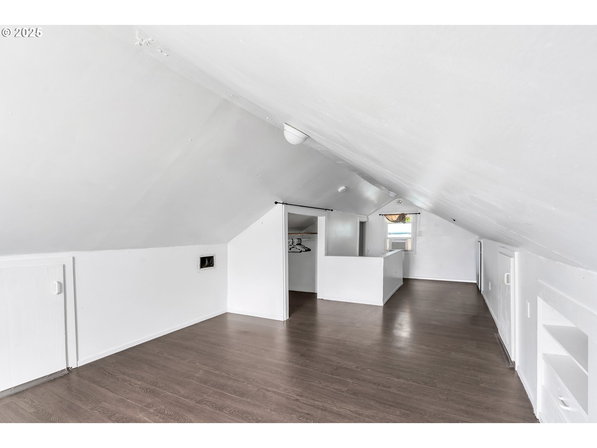 8451 Southeast Bush Street Portland, OR 97266 - Photo 30 of 47 a view of empty room with wooden floor