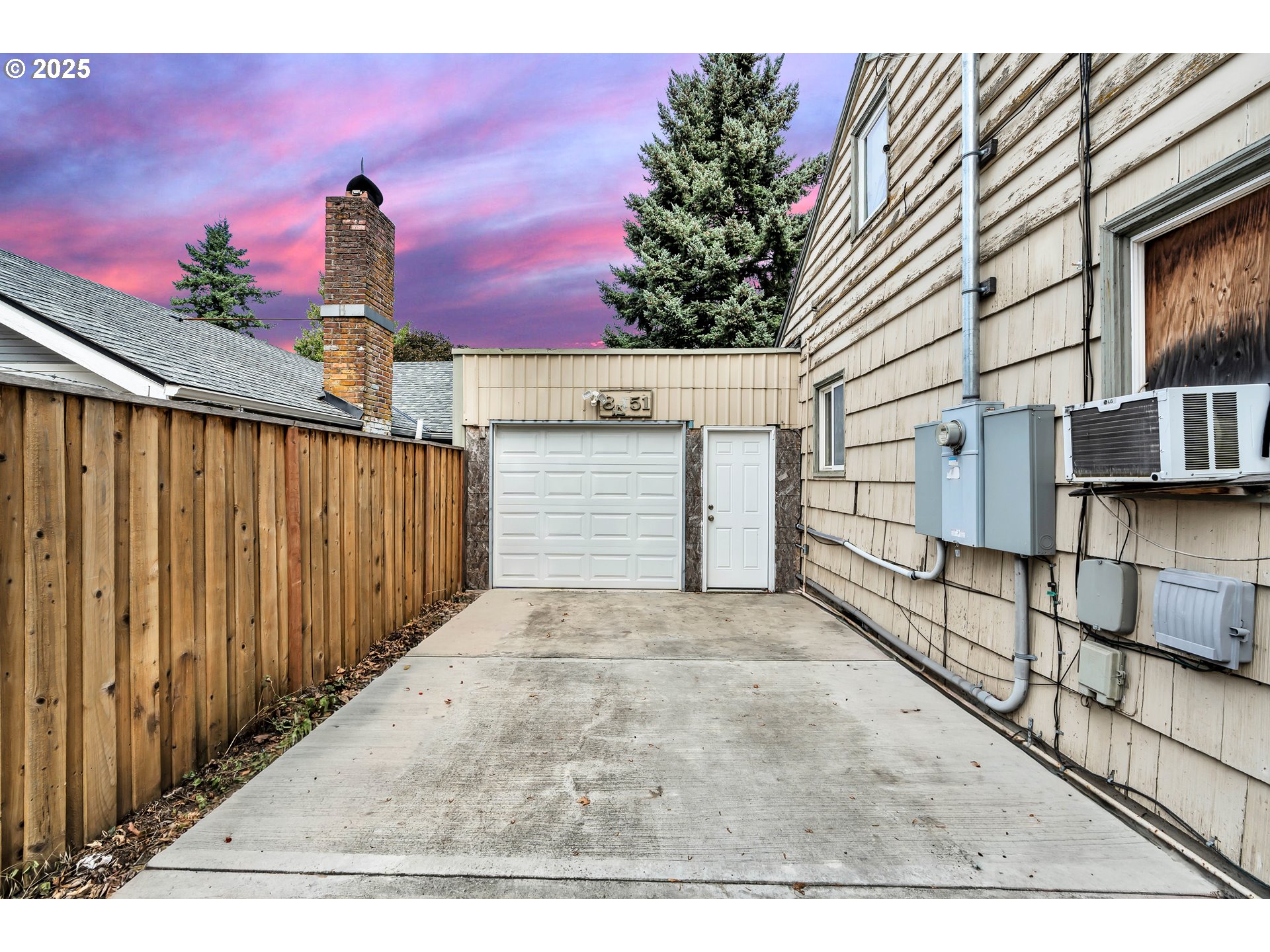 8451 Southeast Bush Street Portland, OR 97266 - Photo 31 of 47 a view of a house with a garage