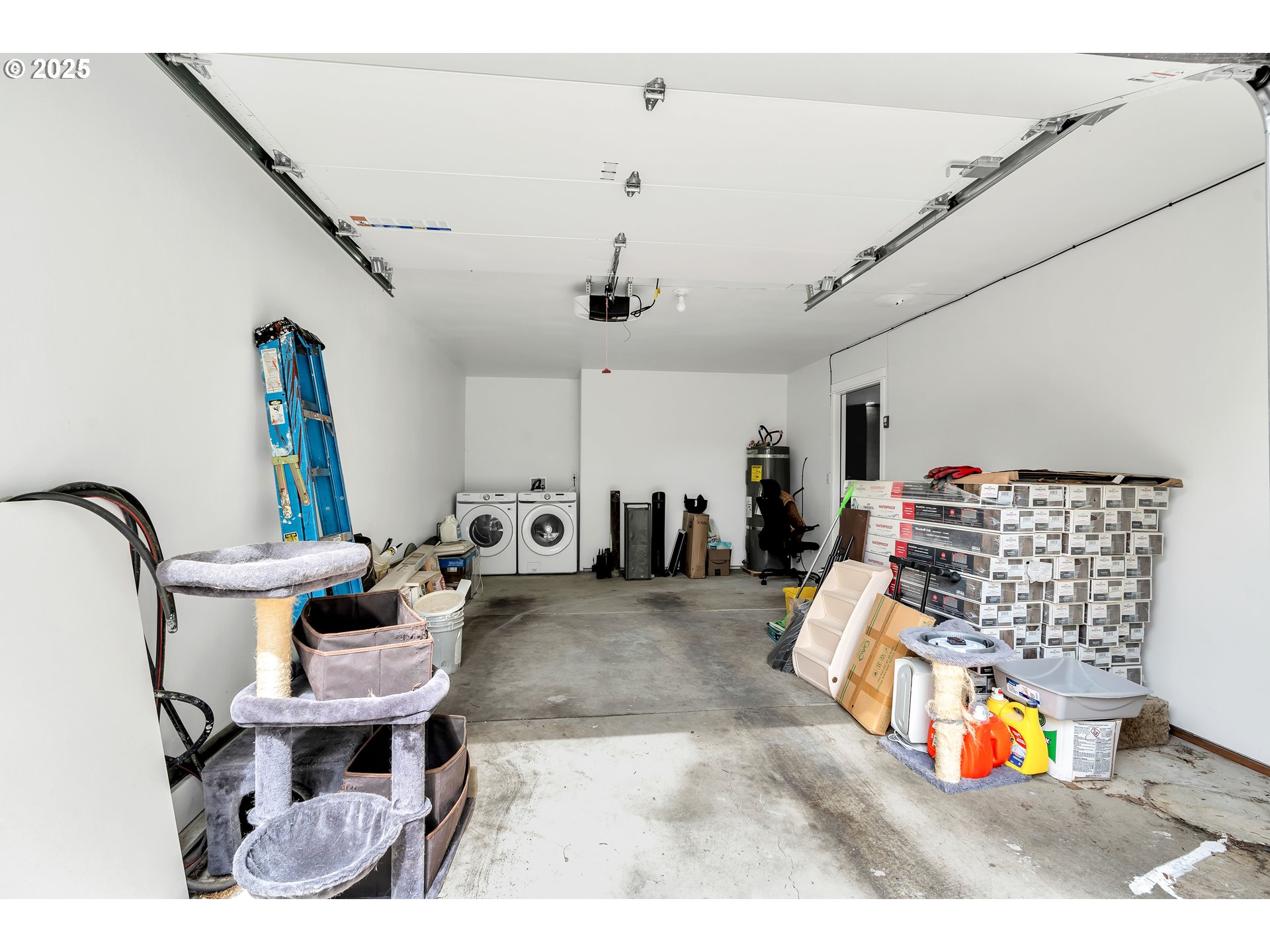 8451 Southeast Bush Street Portland, OR 97266 - Photo 32 of 47 a living room with furniture a rug and white walls