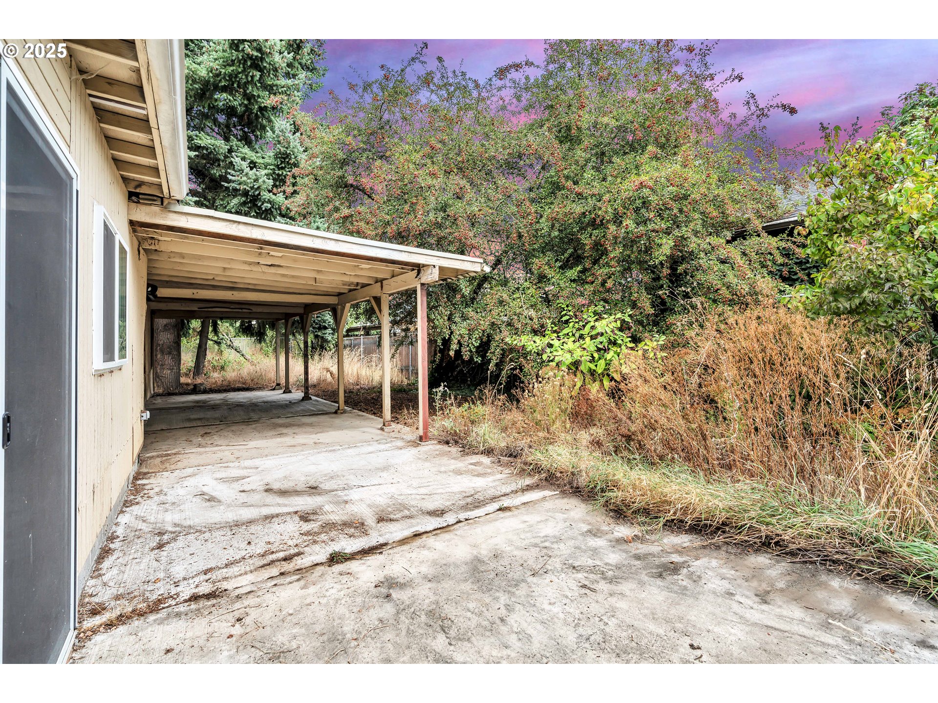 8451 Southeast Bush Street Portland, OR 97266 - Photo 34 of 47 a view of a chairs and table in the backyard