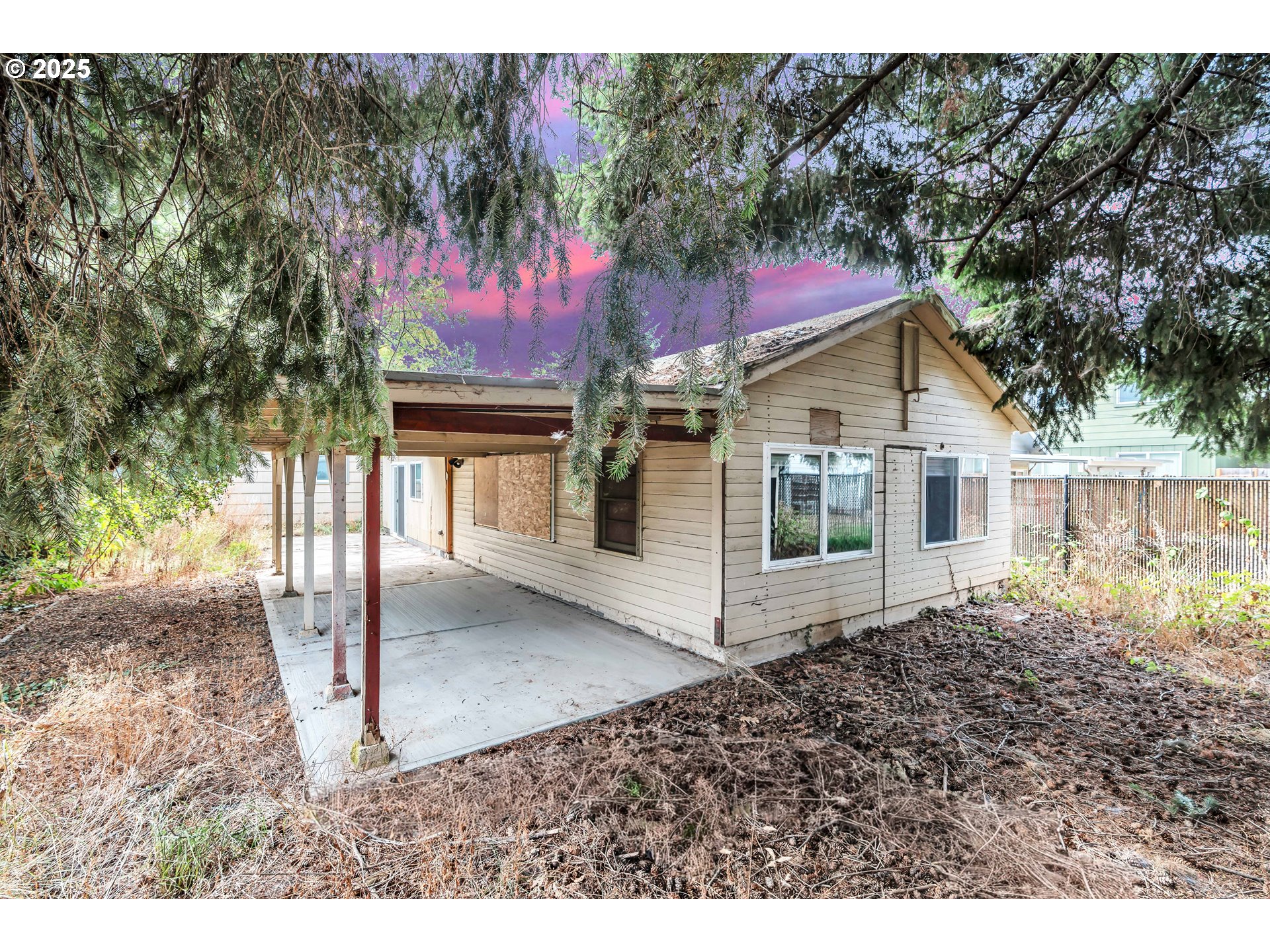 8451 Southeast Bush Street Portland, OR 97266 - Photo 36 of 47 a view of a house with a small yard and large tree