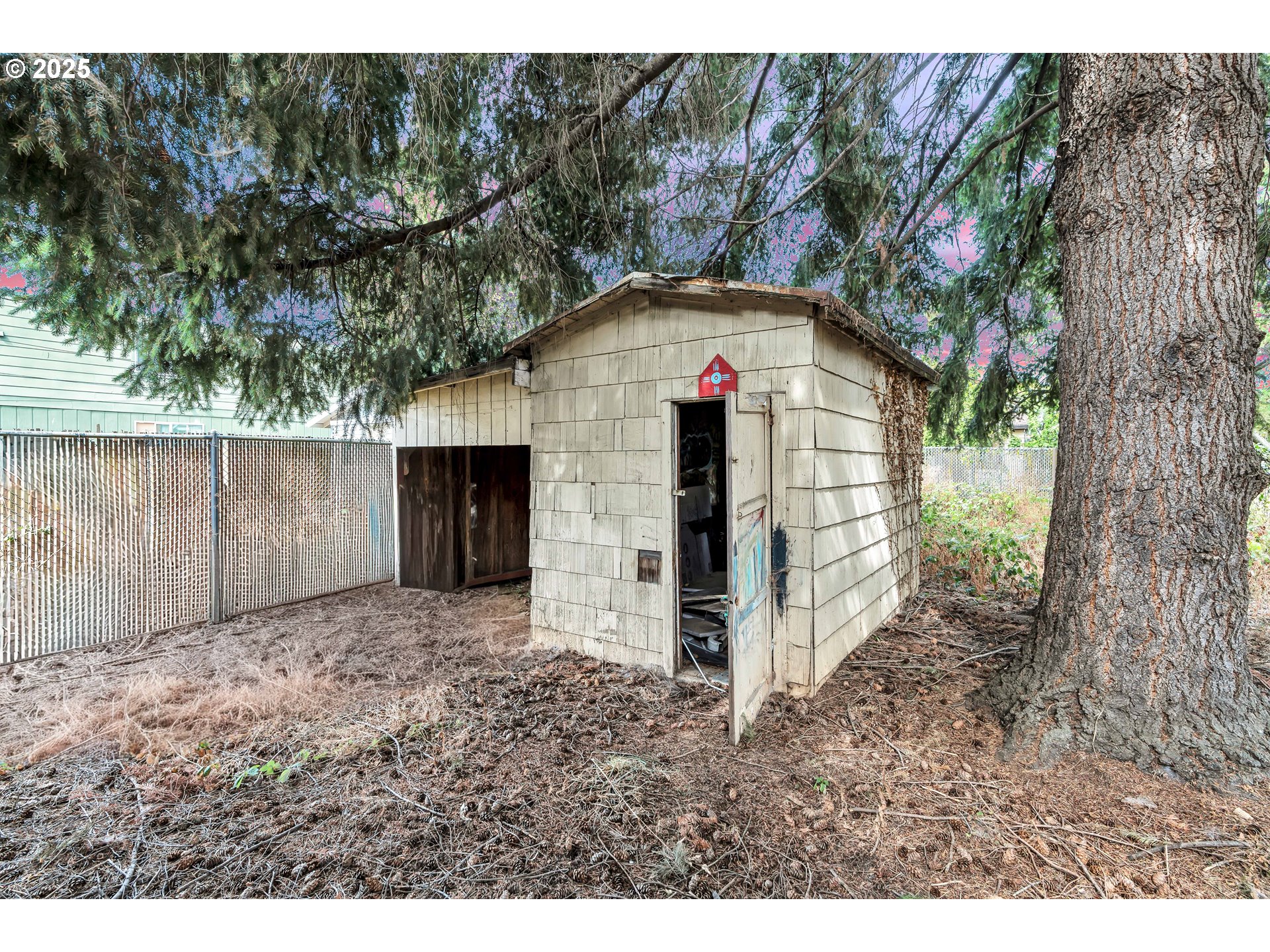 8451 Southeast Bush Street Portland, OR 97266 - Photo 38 of 47 a front view of a house with a yard